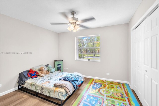 4271 SW 67th Ter, Davie, FL 33314 - bedroom featuring baseboards, a closet, wood finished floors, and ceiling fan