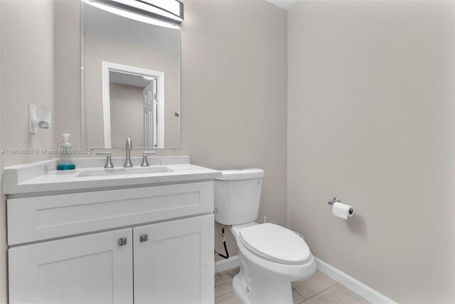 4271 SW 67th Ter, Davie, FL 33314 - bathroom featuring toilet, vanity, baseboards, and tile patterned floors
