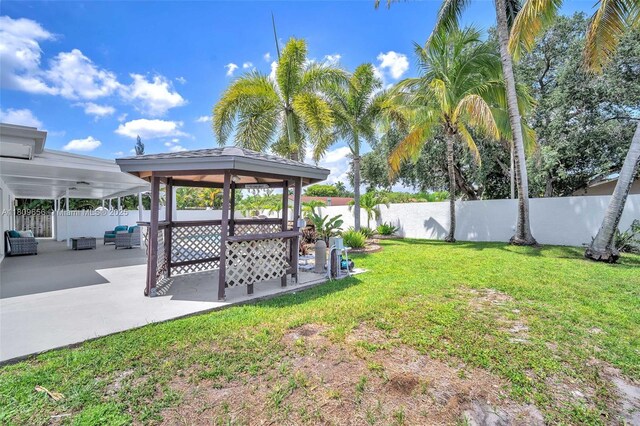4271 SW 67th Ter, Davie, FL 33314 - view of yard featuring an outdoor living space, a gazebo, and a patio