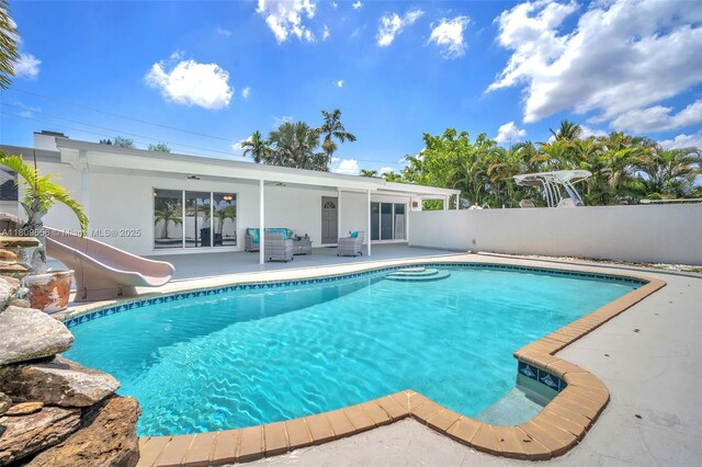 4271 SW 67th Ter, Davie, FL 33314 - view of swimming pool with a water slide and a patio