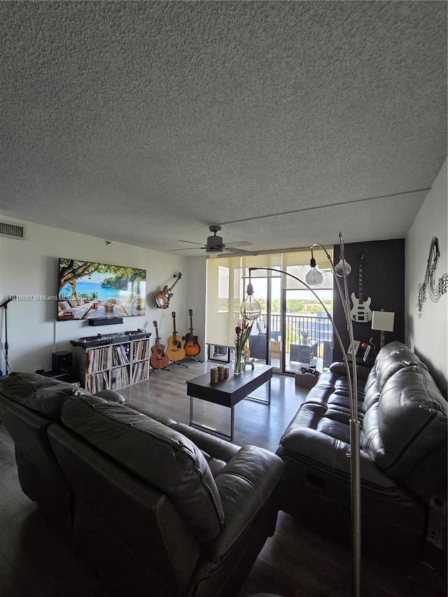 900 NE 195th St Unit 709, Miami, FL 33179 - living area featuring a textured ceiling and ceiling fan