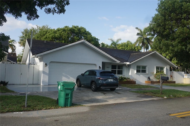 14652 SW 110th St, Miami, FL 33186 - single story home with an attached garage, stucco siding, concrete driveway, and a gate