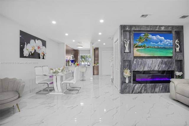 17306 SW 139th Ct, Miami, FL 33177 - living area with recessed lighting, light marble finish floors, and a glass covered fireplace