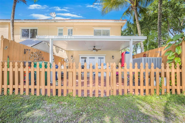 17306 SW 139th Ct, Miami, FL 33177 - view of front of property featuring ceiling fan, a fenced front yard, and stucco siding