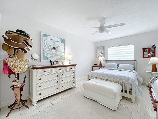 708 SE 7th Ave Unit 14, Pompano Beach, FL 33060 - bedroom with light tile patterned flooring, a ceiling fan, and baseboards