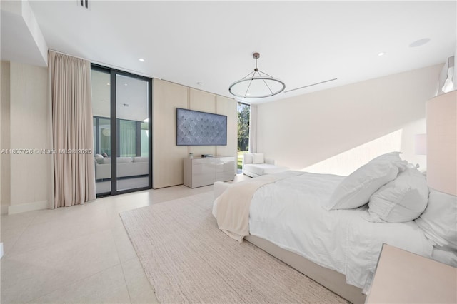 9450 SW 98th St, Miami, FL 33176 - bedroom with access to exterior, expansive windows, and tile patterned flooring