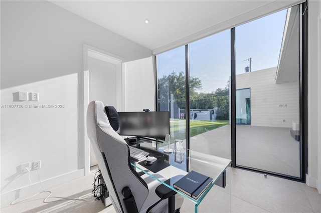 9450 SW 98th St, Miami, FL 33176 - office featuring light tile patterned flooring, baseboards, a wall of windows, and recessed lighting