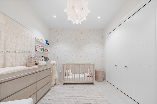 9450 SW 98th St, Miami, FL 33176 - bedroom with a nursery area, a chandelier, recessed lighting, and a closet