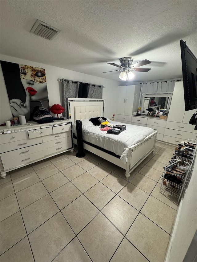 1929 SW 50th Ave, Fort Lauderdale, FL 33317 - bedroom with light tile patterned floors, a textured ceiling, and ceiling fan