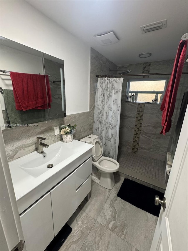 1929 SW 50th Ave, Fort Lauderdale, FL 33317 - full bathroom with marble look tiles, vanity, toilet, a stall shower, and tile walls