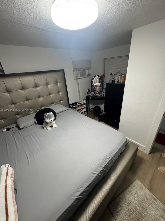 1929 SW 50th Ave, Fort Lauderdale, FL 33317 - bedroom with wood finished floors and a textured ceiling