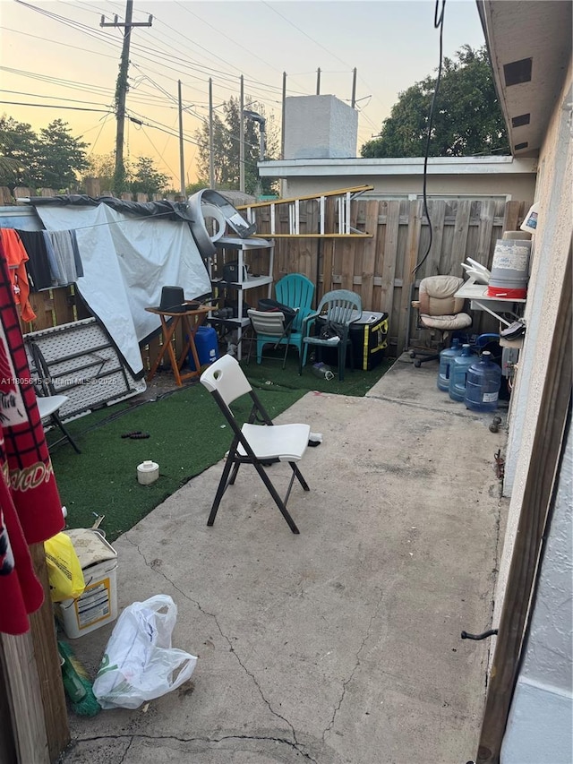 1929 SW 50th Ave, Fort Lauderdale, FL 33317 - patio terrace at dusk featuring a patio area