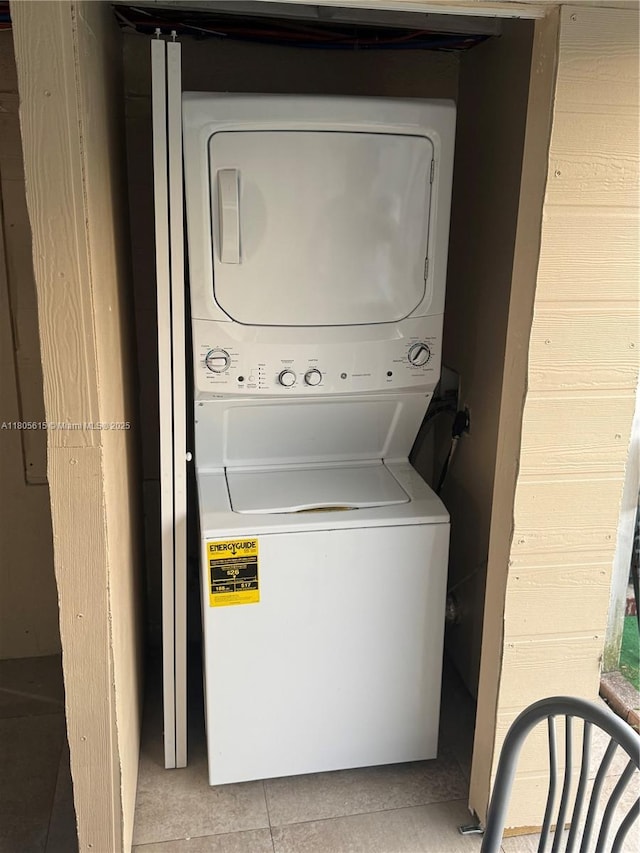 1929 SW 50th Ave, Fort Lauderdale, FL 33317 - laundry room with stacked washing machine and dryer and tile patterned floors