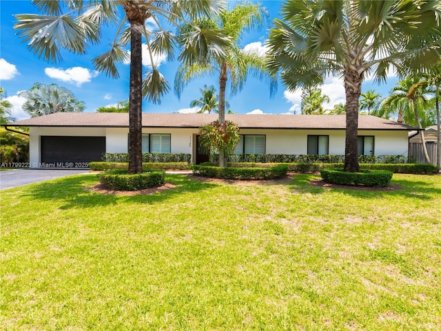 11145 SW 126th St, Miami, FL 33176 - ranch-style home featuring stucco siding, an attached garage, asphalt driveway, and a front yard