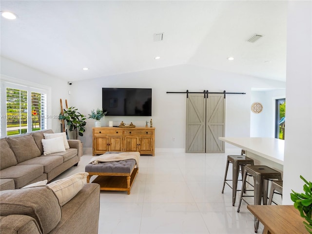 11145 SW 126th St, Miami, FL 33176 - living room with a barn door, vaulted ceiling, recessed lighting, and light marble finish floors