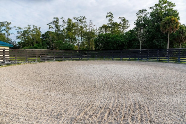 1230 F Rd, Loxahatchee, FL 33470 - view of community featuring an enclosed riding area and view of wooded area