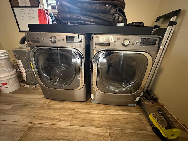 1230 F Rd, Loxahatchee, FL 33470 - washroom featuring washer and clothes dryer and wood finished floors
