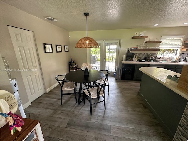 1230 F Rd, Loxahatchee, FL 33470 - dining room featuring dark wood-type flooring, a textured ceiling, healthy amount of natural light, french doors, and recessed lighting