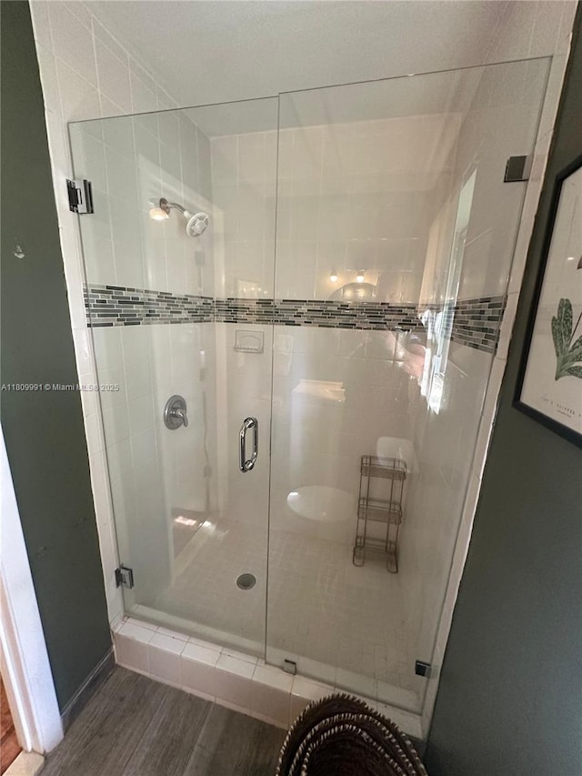 1230 F Rd, Loxahatchee, FL 33470 - bathroom featuring a stall shower and wood finished floors