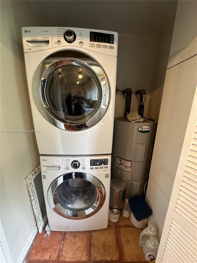1230 F Rd, Loxahatchee, FL 33470 - washroom with stacked washer and clothes dryer and water heater