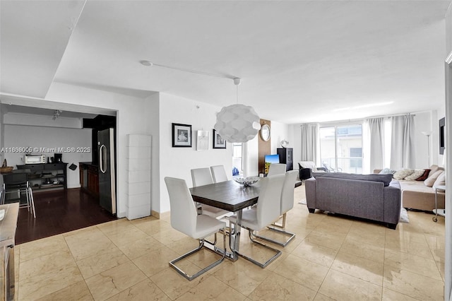 9195 Collins Ave Unit 304, Surfside, FL 33154 - dining room featuring light tile patterned flooring