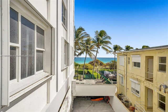 9195 Collins Ave Unit 304, Surfside, FL 33154 - stairs with french doors and heating unit