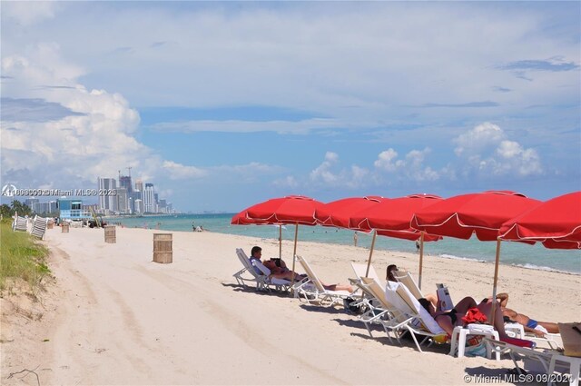 9195 Collins Ave Unit 304, Surfside, FL 33154 - view of apartment building / complex featuring uncovered parking