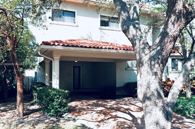 400 Woodcrest Rd, Key Biscayne, FL 33149 - view of front of house with stucco siding and a tiled roof