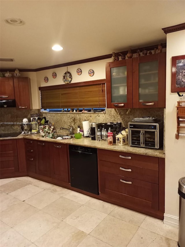 400 Woodcrest Rd, Key Biscayne, FL 33149 - kitchen with black appliances, backsplash, under cabinet range hood, a sink, and glass insert cabinets