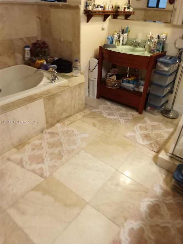 400 Woodcrest Rd, Key Biscayne, FL 33149 - full bath featuring a relaxing tiled tub, vanity, and tile patterned floors