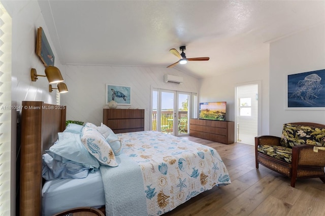 460 Barry Ave, Lower Keys, FL 33042 - bedroom with a wall mounted air conditioner, lofted ceiling, wood finished floors, access to exterior, and ceiling fan
