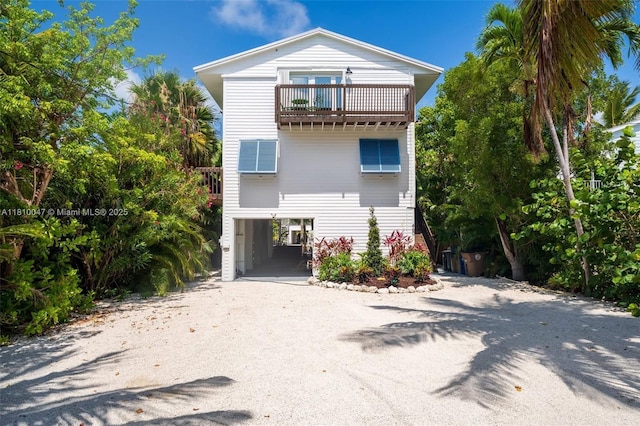 460 Barry Ave, Lower Keys, FL 33042 - coastal inspired home with a carport, a balcony, and driveway