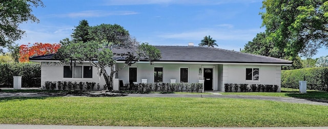 7941 SW 143rd St, Palmetto Bay, FL 33158 - view of front of house with a front yard, stucco siding, and covered porch