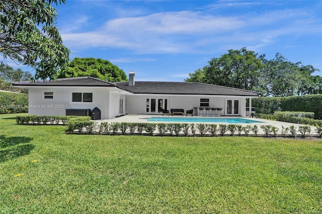 7941 SW 143rd St, Palmetto Bay, FL 33158 - back of house with french doors, an outdoor pool, a yard, stucco siding, and a patio area