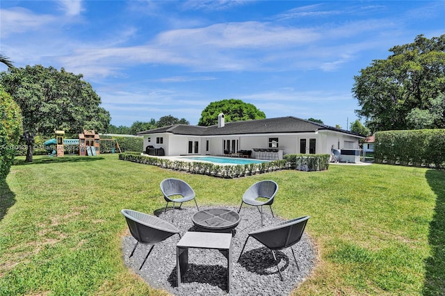 7941 SW 143rd St, Palmetto Bay, FL 33158 - view of grassy yard with an outdoor pool and french doors