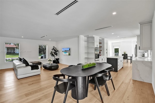 7941 SW 143rd St, Palmetto Bay, FL 33158 - dining space with light wood-style floors and recessed lighting