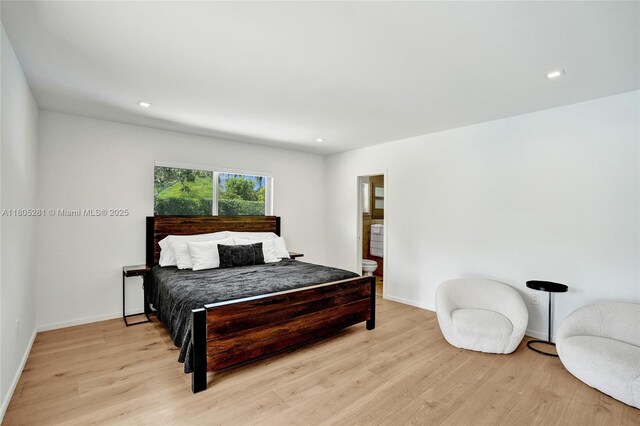 7941 SW 143rd St, Palmetto Bay, FL 33158 - bedroom with light wood-style flooring, recessed lighting, and ensuite bathroom