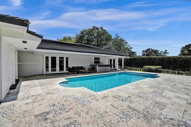 7941 SW 143rd St, Palmetto Bay, FL 33158 - view of swimming pool featuring french doors, a patio area, and outdoor lounge area