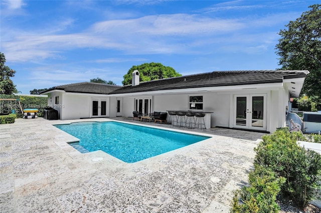 7941 SW 143rd St, Palmetto Bay, FL 33158 - outdoor pool with french doors and a patio area