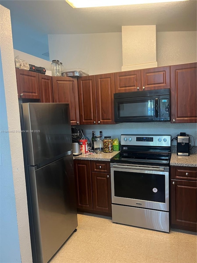 20390 SW 119th Ave, Miami, FL 33177 - kitchen featuring stainless steel appliances and light stone counters