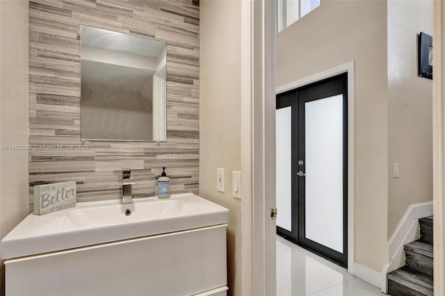 1070 Briar Ridge Rd, Weston, FL 33327 - bathroom with vanity, tile walls, and baseboards
