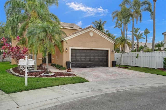 1070 Briar Ridge Rd, Weston, FL 33327 - view of front of property featuring stucco siding, driveway, a garage, and a tile roof