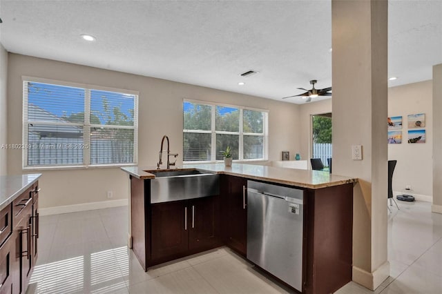 1070 Briar Ridge Rd, Weston, FL 33327 - kitchen with dishwasher, a sink, light stone countertops, a ceiling fan, and baseboards