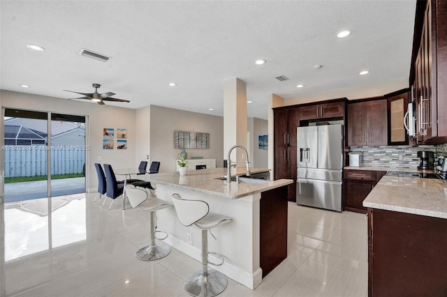 1070 Briar Ridge Rd, Weston, FL 33327 - kitchen with appliances with stainless steel finishes, a sink, light stone counters, decorative backsplash, and recessed lighting