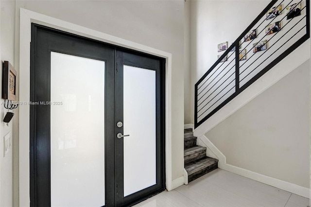 1070 Briar Ridge Rd, Weston, FL 33327 - entrance foyer with stairs, baseboards, and french doors