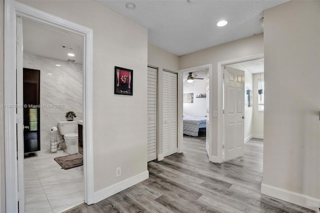 1070 Briar Ridge Rd, Weston, FL 33327 - hallway featuring baseboards and wood finished floors