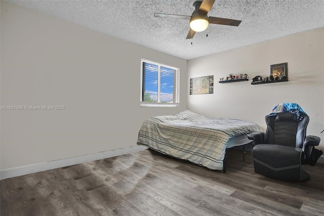 1070 Briar Ridge Rd, Weston, FL 33327 - bedroom featuring wood finished floors, a textured ceiling, a ceiling fan, and baseboards