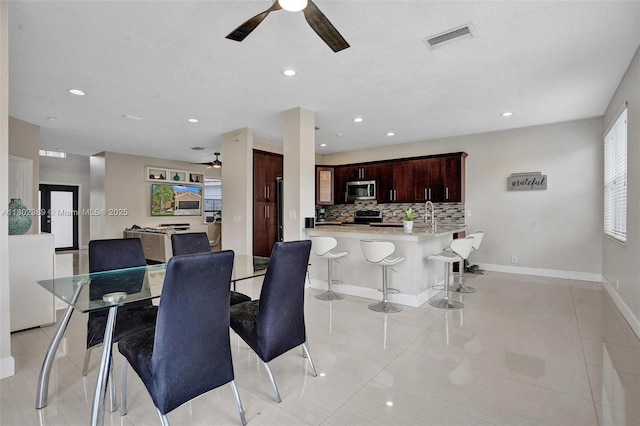 1070 Briar Ridge Rd, Weston, FL 33327 - dining area featuring a ceiling fan, light tile patterned flooring, recessed lighting, and baseboards