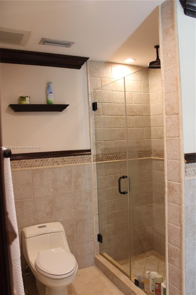 9941 SW 97th Ct, Miami, FL 33176 - full bathroom with a shower stall, tile walls, toilet, tile patterned floors, and wainscoting