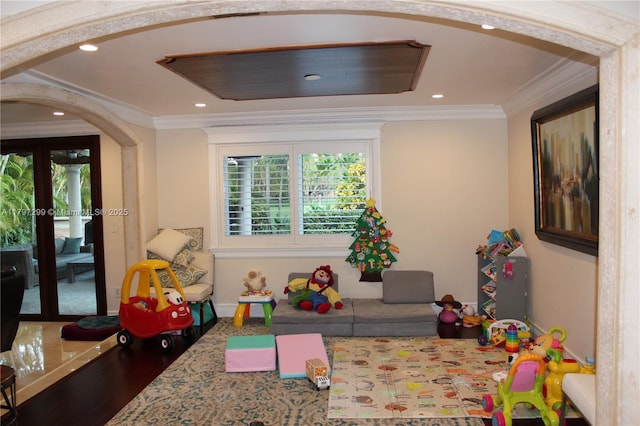 9941 SW 97th Ct, Miami, FL 33176 - playroom featuring arched walkways, crown molding, recessed lighting, wood finished floors, and baseboards